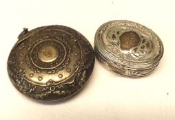 A Mixed Lot: a small white metal Travelling Round Powder Compact with hinged mirrored lid, decorated