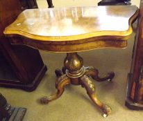 A Victorian Walnut Veneered Folding Card Table, with folding top and baize-lined interior,