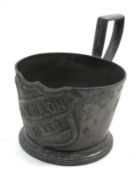 A Vintage Pewter Glass Holder, the front marked with a shield, Bouillon Fleet, 4” wide