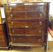 A 19th Century Mahogany Bow Fronted Chest of five graduated drawers, flanked on either side by