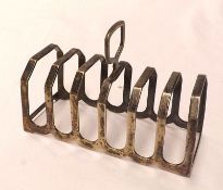 A George VI Six Slice Toast Rack of typical form, Birmingham 1941, Maker’s Mark SL, total weight 2.2