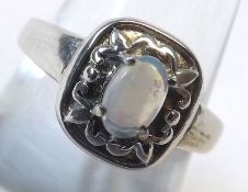 A hallmarked Sterling Silver Ring set with a multi-coloured Opal