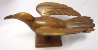 A Hardwood Model of a Bird on rectangular plinth base, wing marked A Souvenir from Pitcairn