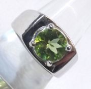 A hallmarked 9ct White Gold Solitaire Ring set with a Peridot