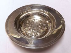 A Queen Elizabeth II small Circular Bowl, the ribbed rim to a Tudor Rose centre, London 1952, 6 ½”