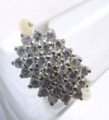 A yellow metal indistinctly marked Diamond Cluster Ring