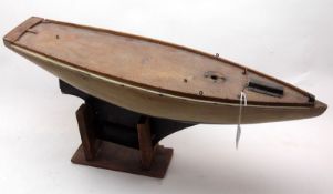 An early 20th Century Timber Framed Boat Hull Neptune, painted in black and cream, mounted on pine