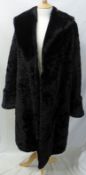 A 1950s Black Beaver Fur Coat, with large shawl collar and wide turn back cuffs, furrier hook and