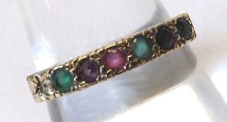 A hallmarked 9ct Gold seven gemstone Ring, spelling the word “D E A R E S T”