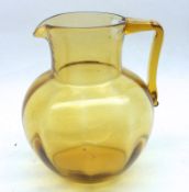 A late 19th Century Amber Glass handled Jug, 8” high