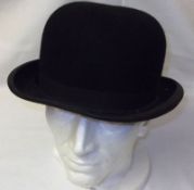 An early 20th Century Gents Black Felt Bowler Hat, ivory silk lined interior bearing label By