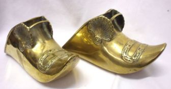 A pair of Spanish or South American Brass Shoe-shaped Stirrups, decorated with shell detail, 11”