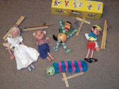 Pelham Puppets to include: Baby Dragon (boxed); Pinocchio; Caterpillar and Fairy (4)