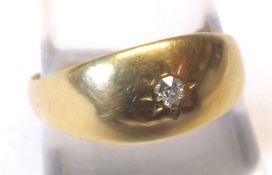 A yellow metal Ring marked 18ct inset with a Diamond chip