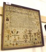 An 18th Century Sampler of typical form, decorated with rows of text, numbers and religious verse,