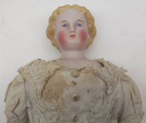 A Bisque Head and Shoulder Plate Doll, painted features to face with moulded hair, cloth body with