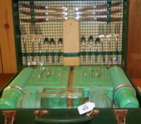 A mid-20th Century Green Cased Picnic Hamper, complete with interior contents, to include two