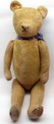 A well-loved early 20th Century Teddy Bear, formerly with mohair covered body, plush filled, lacking