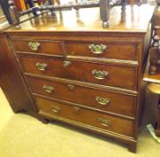An early 19th Century Oak and Crossbanded Chest of two short and three full length drawers with