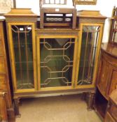 A late 19th/early 20th Century Mahogany Drop Centre Display Cabinet, decorated with fretwork and