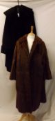 A Black 1950s Astrakhan type Coat with large shawl collar and turned back cuff detail; together with