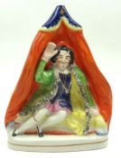 A 19th Century Staffordshire Model of a seated figure in robes