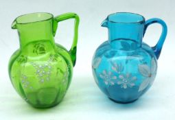 Two late 19th Century Glass Jugs, one Turquoise and one Green, both decorated with white floral