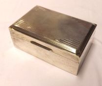 A George VI Cigarette Box, the hinged top with engine-turned detail in the Art Deco manner, wood