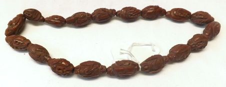 An Eastern style Carved Composition Necklace