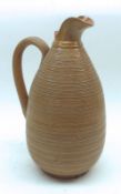 A 19th Century tapering narrow neck Stoneware Jug, decorated with a geometric banded design, 9 ½”