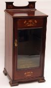 A late Victorian Mahogany Side or Music Cabinet, with lifting lid, single bevelled glazed door,