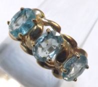 A hallmarked 9ct Gold Ring set with three Blue Zircons