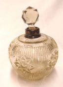An early 20th Century Squat Glass Dressing Table Bottle, with star-cut detail, with a London