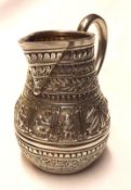 A Victorian Cream Jug, fitted with a scroll handle, decorated with various bands of foliage and