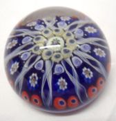 A 20th Century Paperweight with central rosette of coloured canes to radiating Latticinio strands on