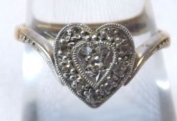 An 18ct Gold hallmarked Gold Ring set with Diamond chips in the form of a heart