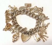 A white metal Charm Bracelet, various Charms formed as Windmills, Cars, Lanterns etc