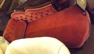 A Victorian Mahogany Chaise Longue, the chevron moulded arched back terminating in ring turned and