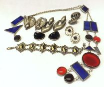 A packet of assorted 20th Century Modernist Jewellery including red and blue glass panelled Long