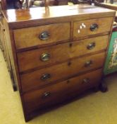 An early 19th Century Mahogany Chest, crossbanded boxwood and ebonised strung top over two short and