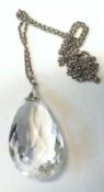 A Facetted Teardrop Shaped Crystal Necklace on metal chain
