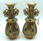 A pair of Zsolnay Pecs Novelty Tapering Double-handled Vases of pierced design, decorated in gilt,