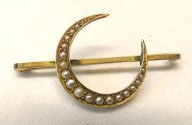 A hallmarked 9ct Gold crescent-shaped Brooch inset with Seed Pearls