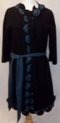 A Moschino Designer style Coat in Black Wool Mix Felt with teal embellishments