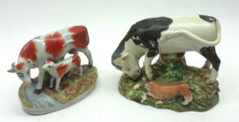 A 19th Century Staffordshire Model of bull baiting; together with a further Model of cow and calf,