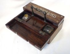 A late 19th Century Rosewood Inkstand, central handle with two lifting lids, each inlaid with