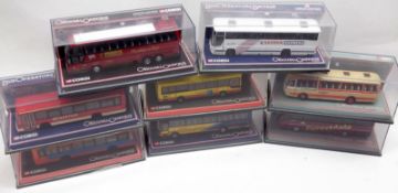 Eight Corgi Original Omnibus Coaches, each housed within a clear Perspex case