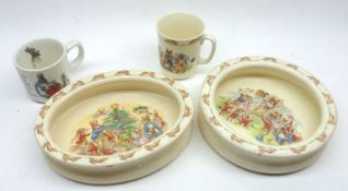 A Mixed Lot: a Wedgwood Peter Rabbit Mug; a Royal Doulton Bunnykins Mug and a further oval Bunnykins