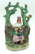 A 19th Century Staffordshire Arbor Group of dancing Scots couple and girl watching, decorated