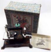A mid-20th Century Tinplate Child’s Sewing Machine of German manufacture